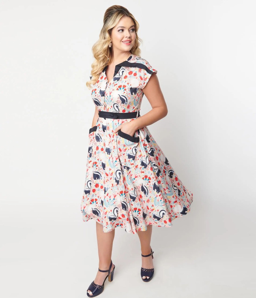 * Unique Vintage Peach Skunk Print Hedda Swing Dress Swing